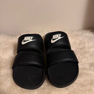 Black with white logo Nike sandals size 9 in men’s